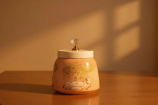 Pichwai Resting Cow Under the Sacred Tree Metal Jar – Blush Peach & Gold | Hand-Painted Decorative Storage Jar with Diamond Crystal Knob Lid