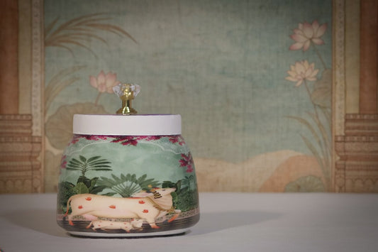 Pichwai Mother Cow & Calf in Blossom Garden Metal Jar – Sage Green & Magenta | Hand-Painted Decorative Storage Jar with Diamond Crystal Knob Lid